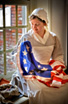 A Re-enactor portrays Betsy Ross